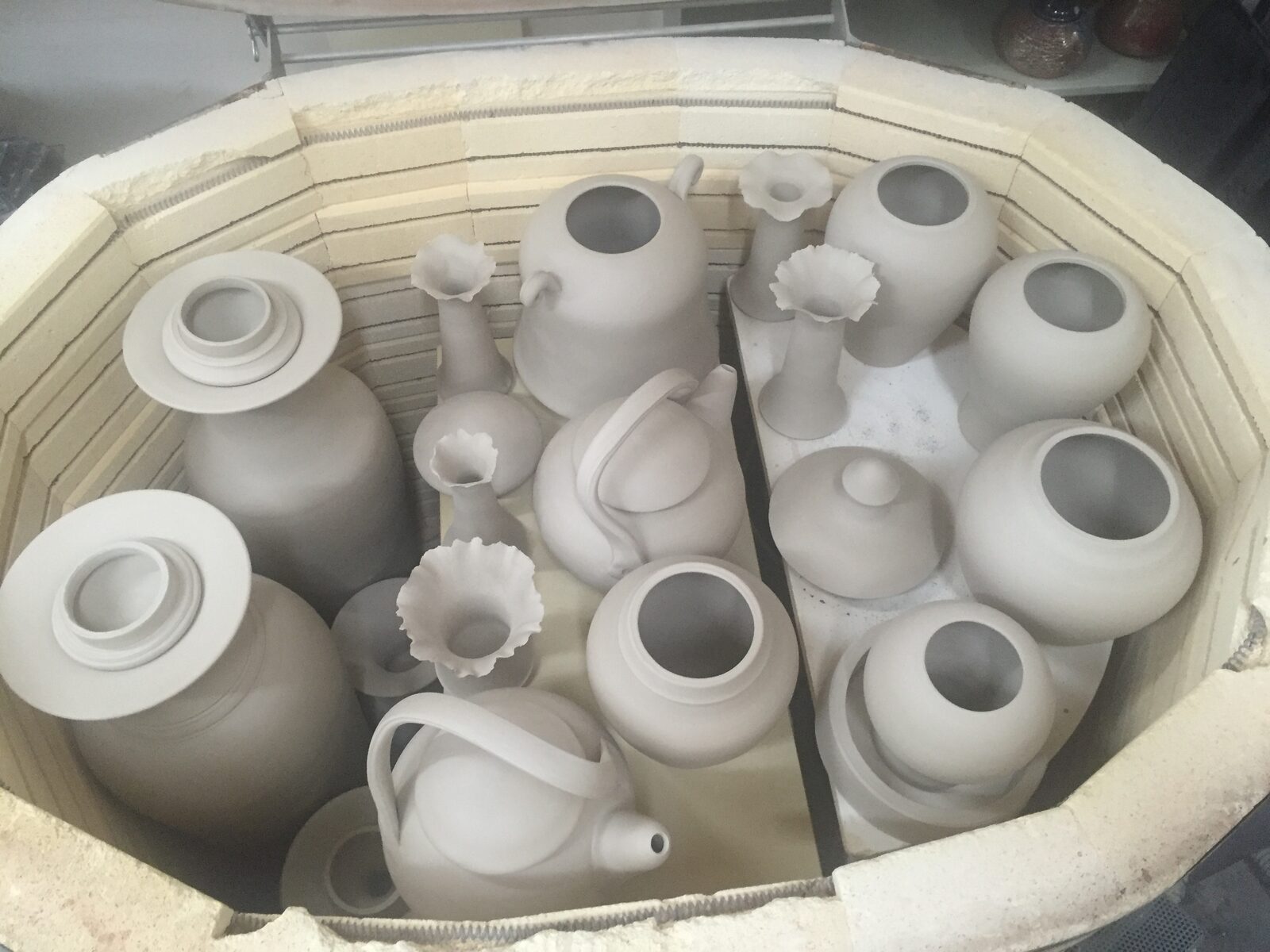 7/11/16 The last 2 weeks I have been firing, glazing and gas firing a bunch of pots. these photos shows the process