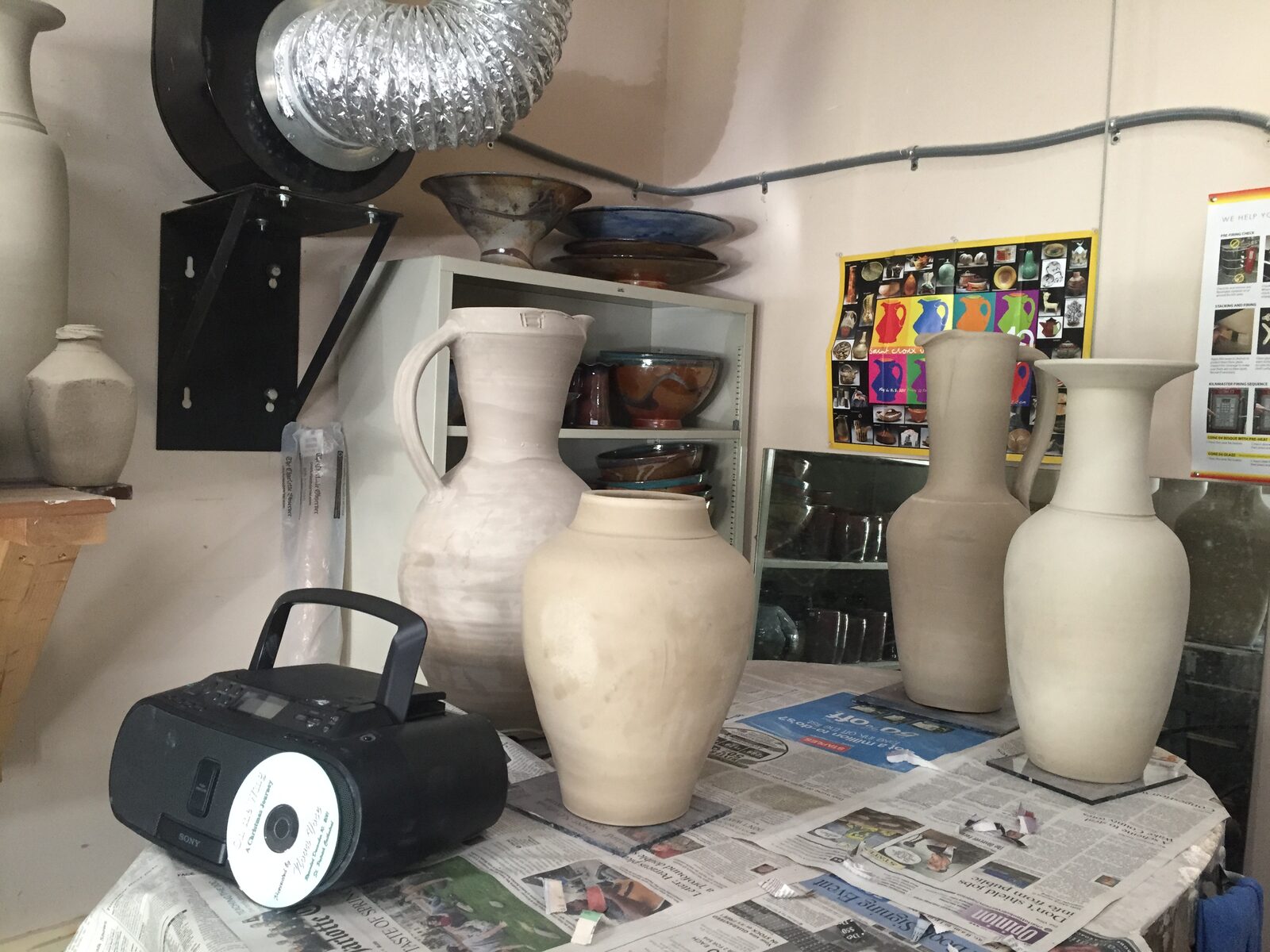 I went to the J.C. Campbell Folk Art School last week and studied under Kevin Crowe. He is an exceptional potter and an excellent teacher. He made the large pitcher to the left. I have been working on jars since I came home.