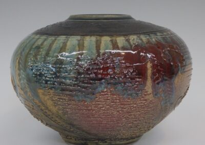 #355  6 3/4″ x 9 1/2″  $295  textured jar