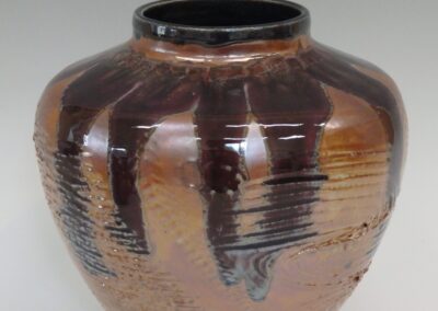 #362  9″ x 9″  $295  textured jar with stained glass