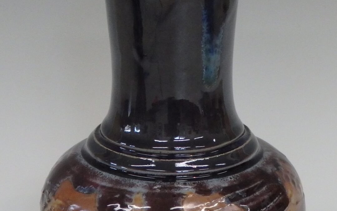 #364  9″ x 6″  $75  textured vase with glass