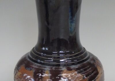 #364  9″ x 6″  $75  textured vase with glass